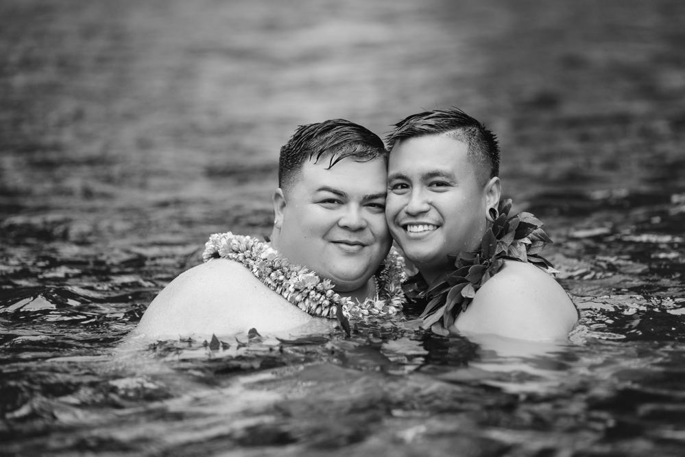Black and white photo of Tylor and Austin cheek to cheek in the water